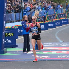 A long-distance runner maintaining effort during a race