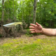 A person captured in the act of throwing an object