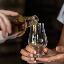 A small measure of whisky served in a glass