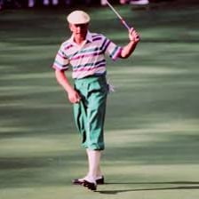 A golfer wearing traditional plus fours trousers