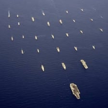 A group of ships sailing together at sea.