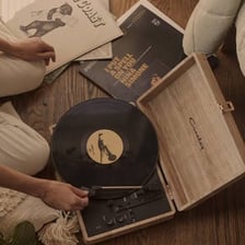 A circular record disc on a turntable