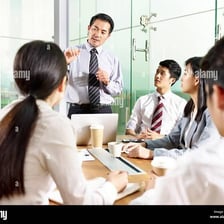 A manager leading a discussion in an office