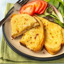 Welsh rarebit consisting of melted cheese served on toast.