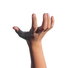 A hand firmly taking hold of an object
