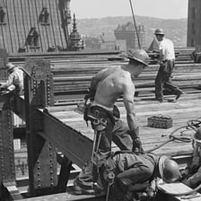 A construction worker carrying out strenuous manual work.