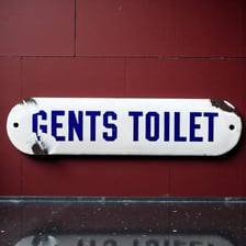 A traditional sign marking a men’s toilet in Britain.