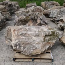 A large boulder resting outdoors