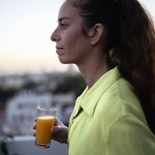 A person reacting to discomfort from hunger