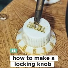 A hand making a small adjustment to a control knob