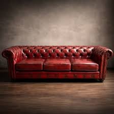 A classic Chesterfield sofa with rolled arms and deep buttoning