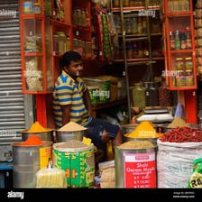 A shopkeeper selling goods.
