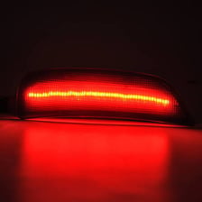 A vehicle side light illuminated beside the main headlamp