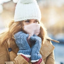 A person wrapped in warm clothing on a cold day.