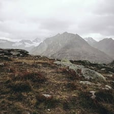 A landscape beneath a heavily overcast sky