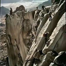 A daring climber tackling a steep mountain face