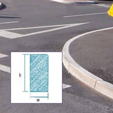 A raised kerb separating a road from a pavement.