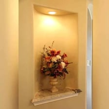 An architectural wall niche forming a recessed alcove.