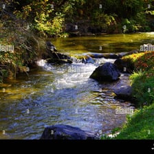 A fast-flowing torrent rushing through a rocky landscape