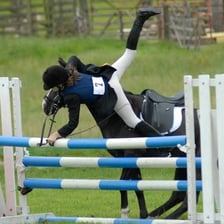 A rider being dislodged from a horse