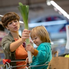A person secretly taking an item in a shop.