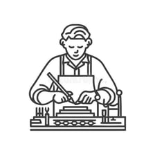 A skilled craftsperson working on a detailed project