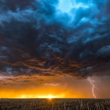 Dark storm clouds approaching over a landscape