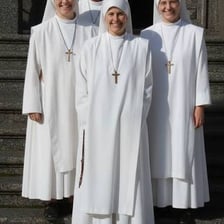 A nun wearing a traditional religious habit.