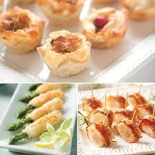 Several small appetisers arranged on serving plates