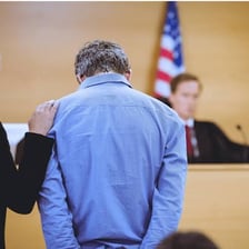 A person formally rejecting or denying an accusation.
