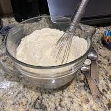 Different ingredients being mixed together in a bowl