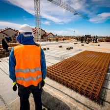 A supervisor monitoring a group of workers