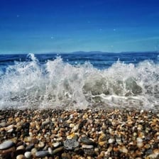 Small rounded pebbles covering a beach