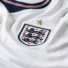 An England football shirt displaying the Three Lions crest.