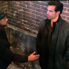 Two people meeting discreetly in an intelligence-related setting.