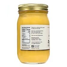 A jar containing golden clarified butter known as ghee