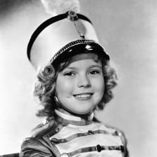 A publicity portrait of 1930s child film star Shirley Temple.