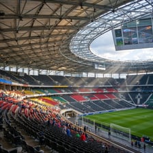 The interior of a modern sports arena prepared for a sporting event.