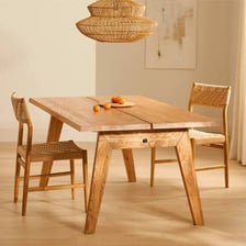A wooden dining table in a room