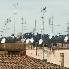 A television aerial mounted on a rooftop.