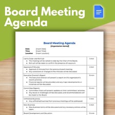 People reviewing charity documents around a meeting table