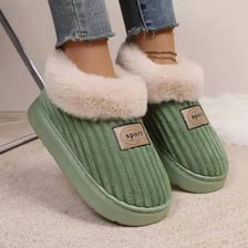 A soft house slipper on an indoor floor