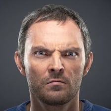 A person showing an intensely angry expression.