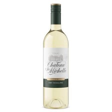 A glass and bottle of Riesling white wine