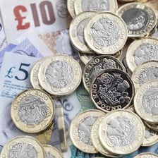 Coins and banknotes representing cash.