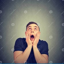 A person reacting with visible surprise.