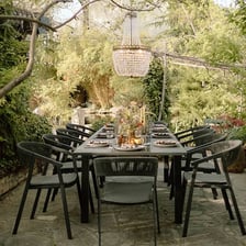 People dining at tables on an outdoor restaurant terrace