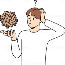 A person thinking carefully while solving a difficult puzzle