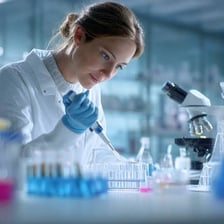 A scientist carrying out a careful, exacting experiment