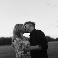 A couple sharing a kiss.